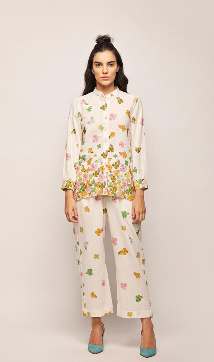 fleur ascending flowers co-ord set,
floral embroidered co-ord set for women,
pastel beige co-ord set,
linen co-ord set with floral embroidery,
summer co-ord set for women,
co-ord set with round hem tunic,
elegant co-ord set for girls,
lightweight tunic co-ord set,
embroidered tunic and trouser set,
co-ord set with pearl and sequin details,
custom size co-ord set,
designer co-ord set for women,
handmade floral co-ord set,
off-white linen co-ord set,
floral jacquard co-ord set,