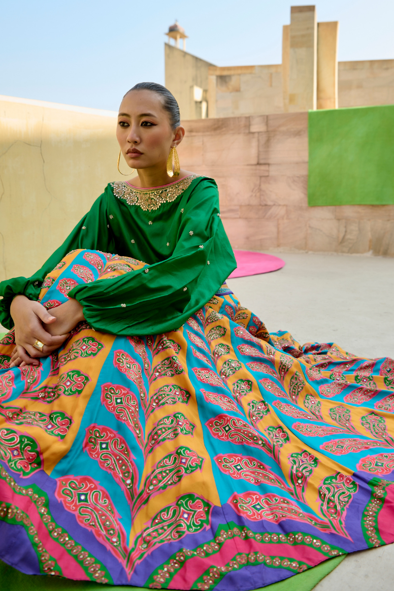 peacock lehenga with green blouse for women,
luxury peacock lehenga with emerald green top,
peacock lehenga with emerald green choli for wedding,
peacock lehenga for special occasions with green top,
designer peacock lehenga with emerald green blouse,
traditional peacock lehenga with emerald green top,
emerald green lehenga with peacock embroidery for weddings,
bridal lehenga with green top,
luxury bridal lehenga with peacock design,
emerald green bridal lehenga,
