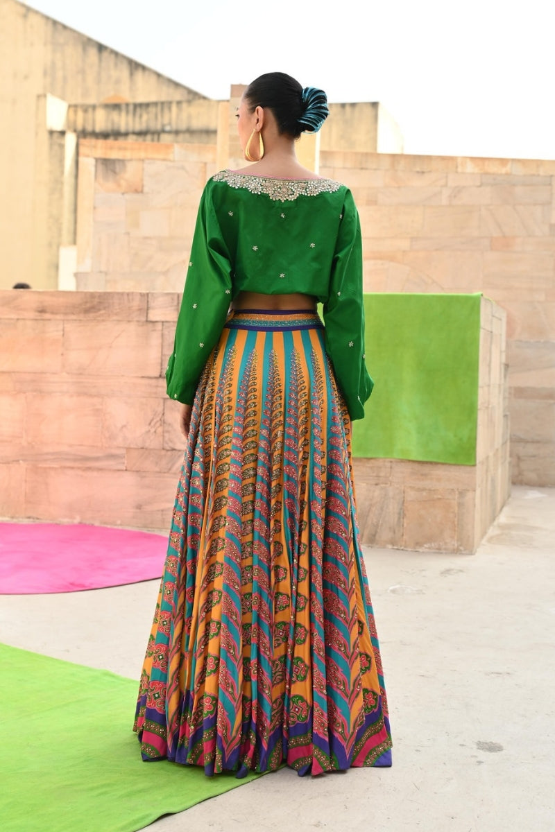 peacock lehenga with green blouse for women,
luxury peacock lehenga with emerald green top,
peacock lehenga with emerald green choli for wedding,
peacock lehenga for special occasions with green top,
designer peacock lehenga with emerald green blouse,
traditional peacock lehenga with emerald green top,
emerald green lehenga with peacock embroidery for weddings,
bridal lehenga with green top,
luxury bridal lehenga with peacock design,
emerald green bridal lehenga,

